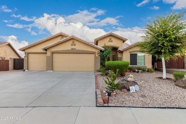 136 N 236th Ave, Buckeye, AZ 85396 - view of front of house with driveway, stucco siding, fence, an attached garage, and a tiled roof