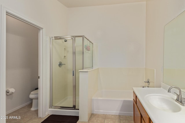 136 N 236th Ave, Buckeye, AZ 85396 - full bath featuring tile patterned floors, toilet, vanity, a garden tub, and a shower stall