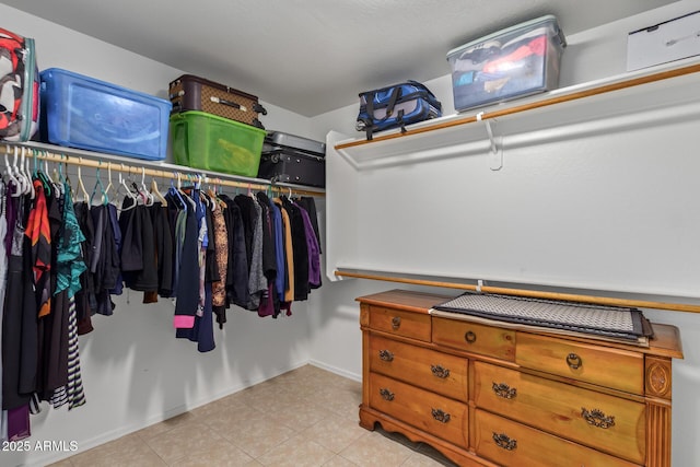136 N 236th Ave, Buckeye, AZ 85396 - walk in closet with light tile patterned floors