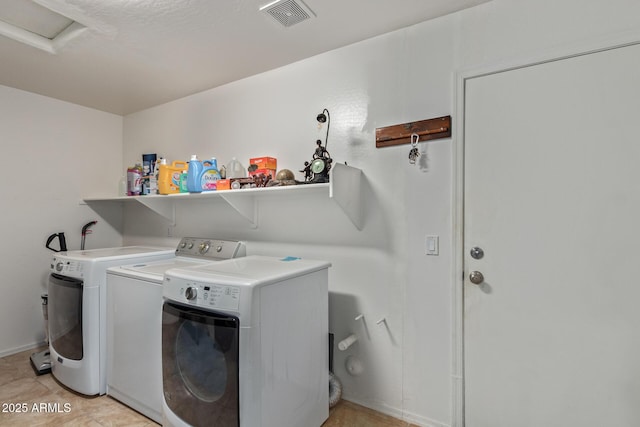 136 N 236th Ave, Buckeye, AZ 85396 - laundry room with washing machine and dryer, visible vents, and laundry area