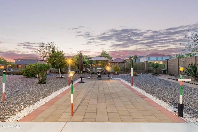 136 N 236th Ave, Buckeye, AZ 85396 - patio terrace at dusk with fence and a gazebo