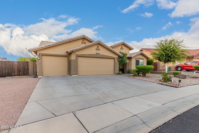 136 N 236th Ave, Buckeye, AZ 85396 - view of front of property featuring driveway, stucco siding, fence, a tiled roof, and a garage
