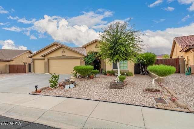 136 N 236th Ave, Buckeye, AZ 85396 - view of front of home featuring a garage, concrete driveway, stucco siding, and fence