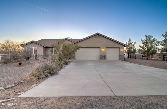 ranch-style home featuring a garage