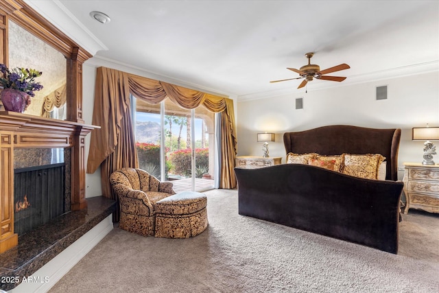 bedroom featuring ceiling fan, carpet flooring, a fireplace, ornamental molding, and access to outside