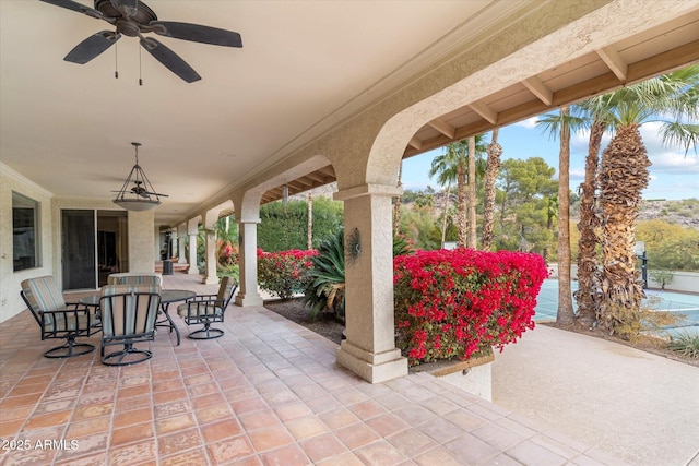 view of patio featuring ceiling fan