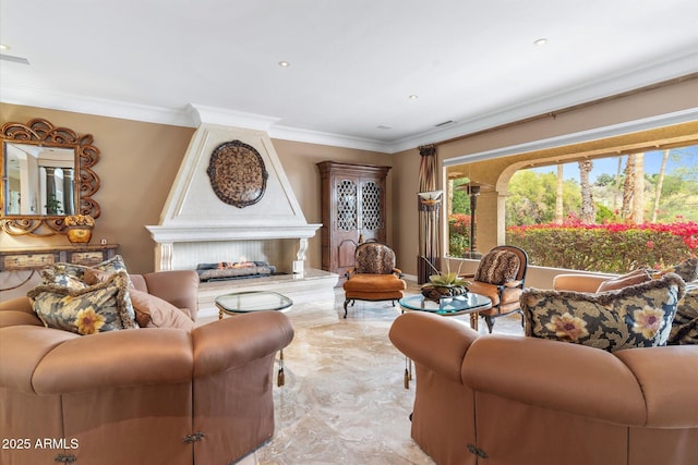 living room with ornamental molding and a fireplace