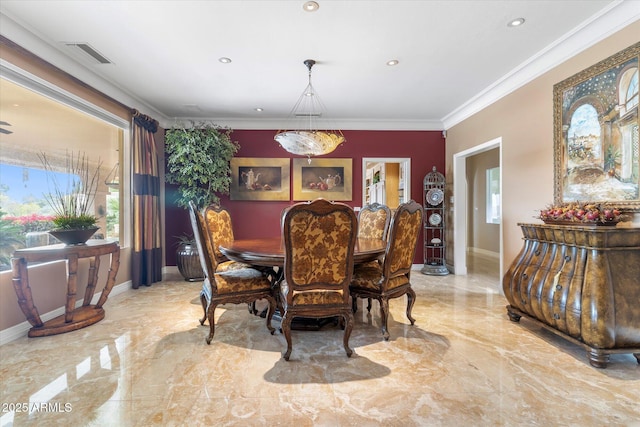 dining area with ornamental molding