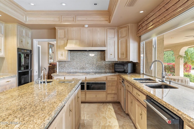 kitchen featuring tasteful backsplash, sink, black appliances, and a raised ceiling