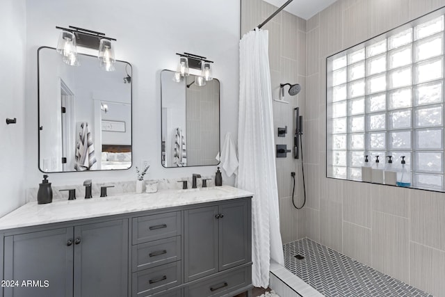 bathroom with a shower with curtain, plenty of natural light, and vanity