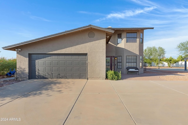 view of side of property featuring a garage