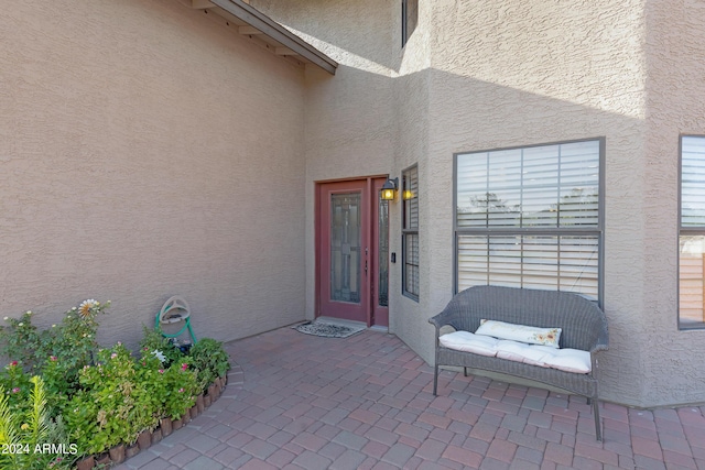 entrance to property featuring a patio area