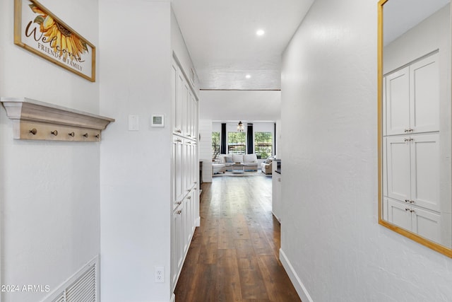 corridor featuring hardwood / wood-style floors