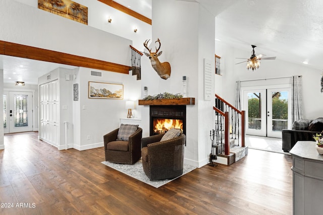 living room featuring ceiling fan, dark hardwood / wood-style flooring, lofted ceiling, and french doors