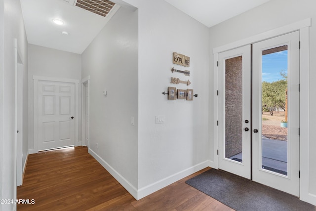 doorway to outside featuring dark wood-type flooring and french doors