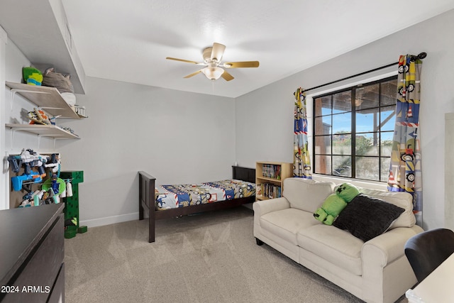 bedroom featuring ceiling fan and carpet