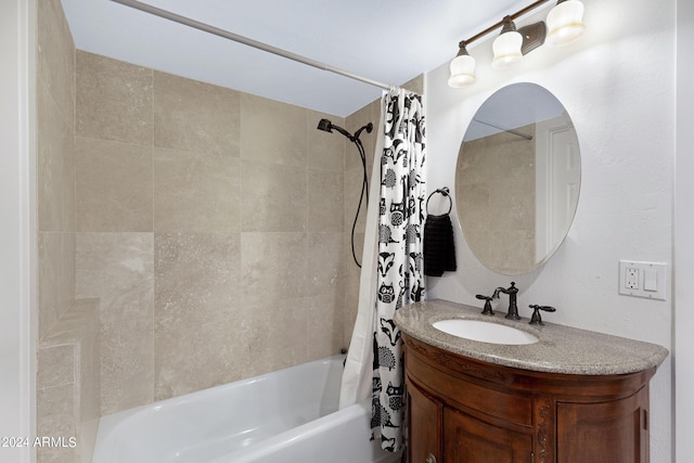 bathroom with shower / bathtub combination with curtain and vanity