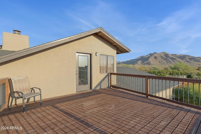 wooden terrace with a mountain view