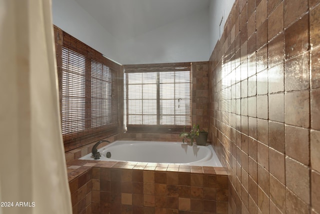 bathroom with tiled bath