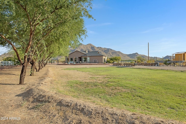 view of yard with a mountain view and a rural view