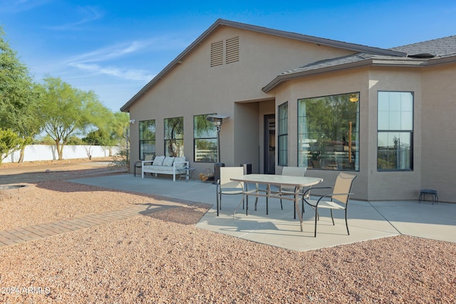 back of house with a patio area