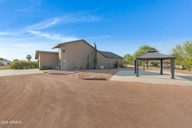 view of home's exterior with a gazebo