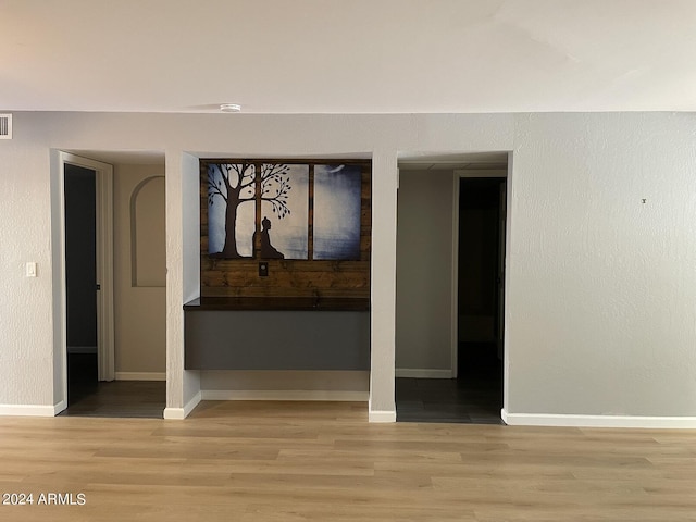 spare room with light hardwood / wood-style flooring