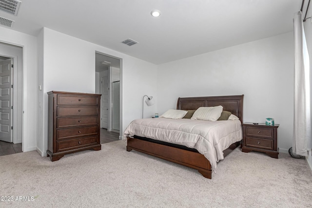 bedroom featuring light carpet