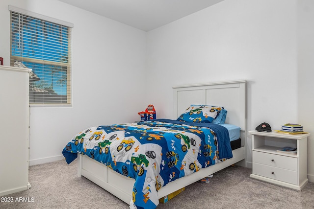 bedroom with light colored carpet