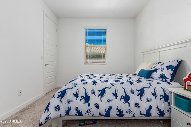 bedroom featuring light carpet