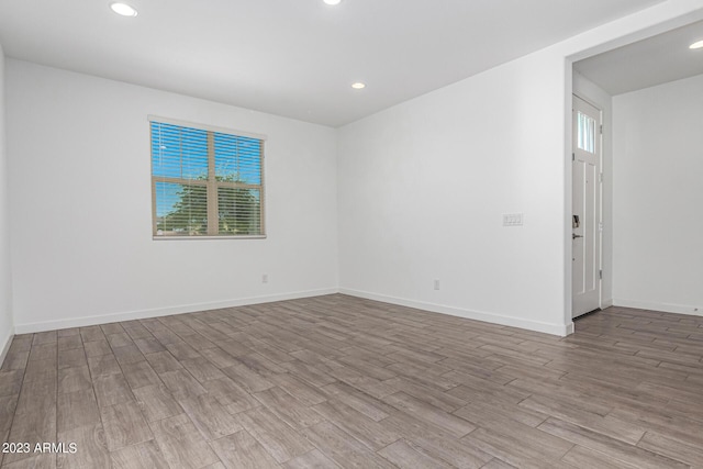 empty room featuring light hardwood / wood-style floors and a wealth of natural light