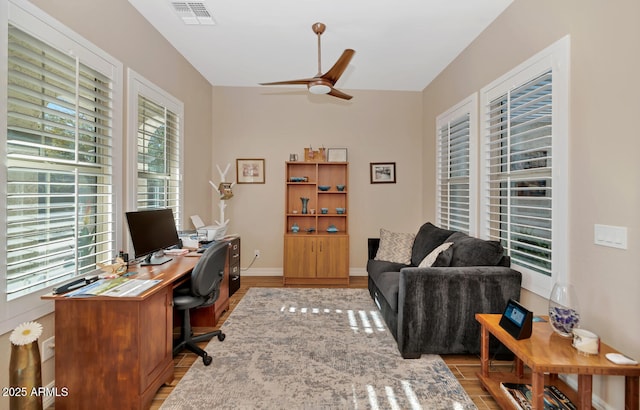 office space with ceiling fan and light hardwood / wood-style floors