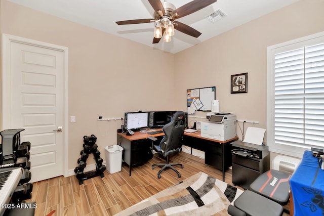 office space featuring ceiling fan