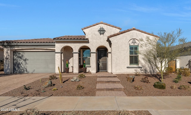 mediterranean / spanish-style house featuring a garage