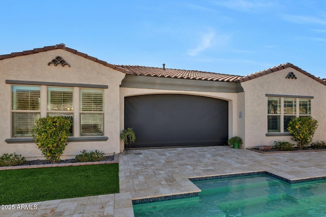 mediterranean / spanish-style house featuring a garage