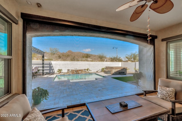 interior space featuring ceiling fan