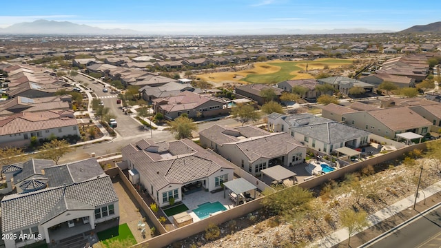 birds eye view of property with a mountain view