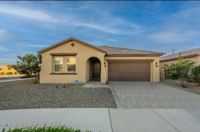 mediterranean / spanish-style house featuring a garage