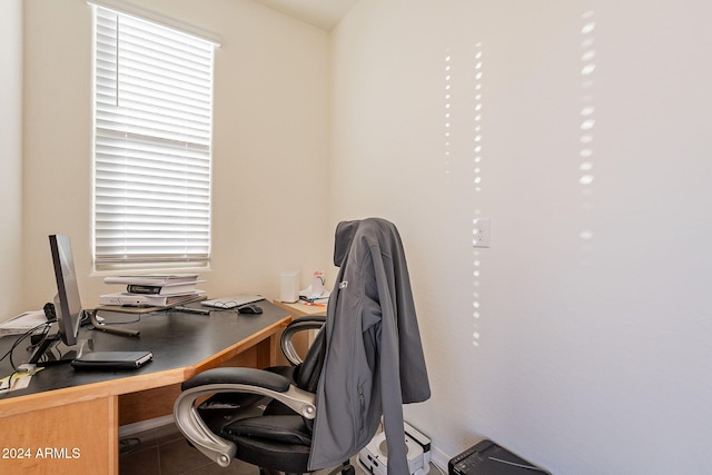 tiled home office with a wealth of natural light