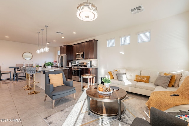 living room featuring light tile patterned flooring