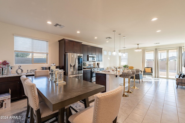 dining room featuring light tile patterned flooring