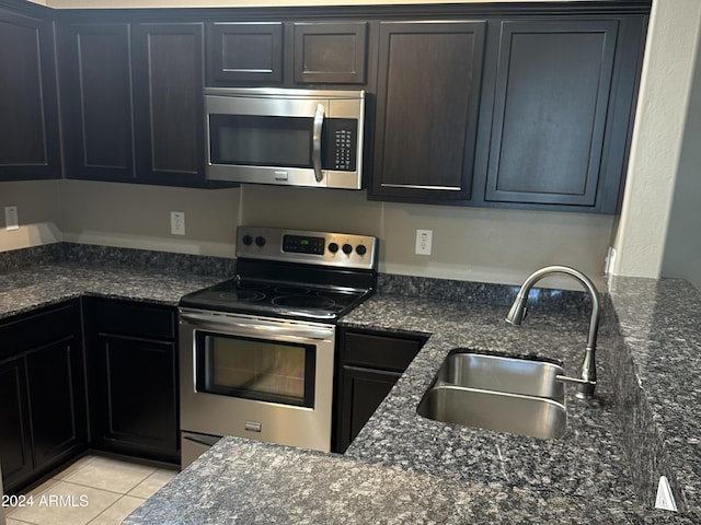 2150 W Alameda Rd Unit 2139, Phoenix, AZ 85085 - kitchen featuring stainless steel appliances, a sink, dark stone countertops, and light tile patterned flooring