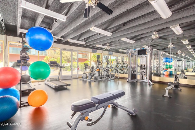 exercise room with ceiling fan