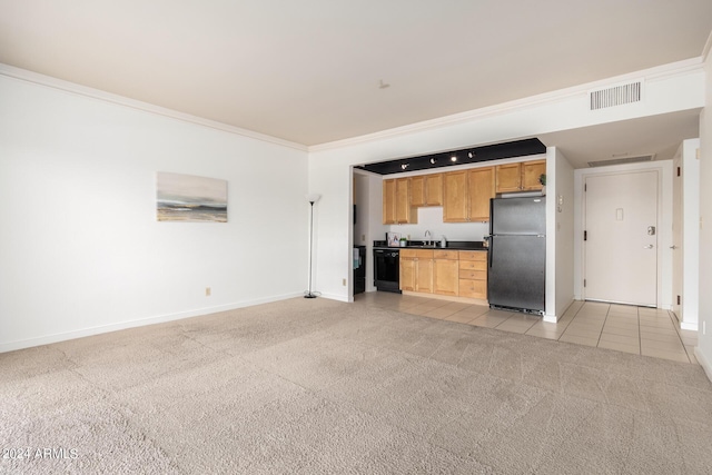 unfurnished living room with ornamental molding and light colored carpet