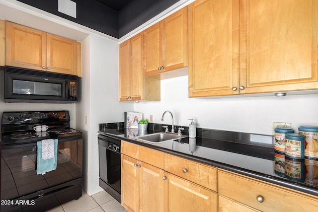 kitchen featuring light tile patterned floors, sink, and black appliances