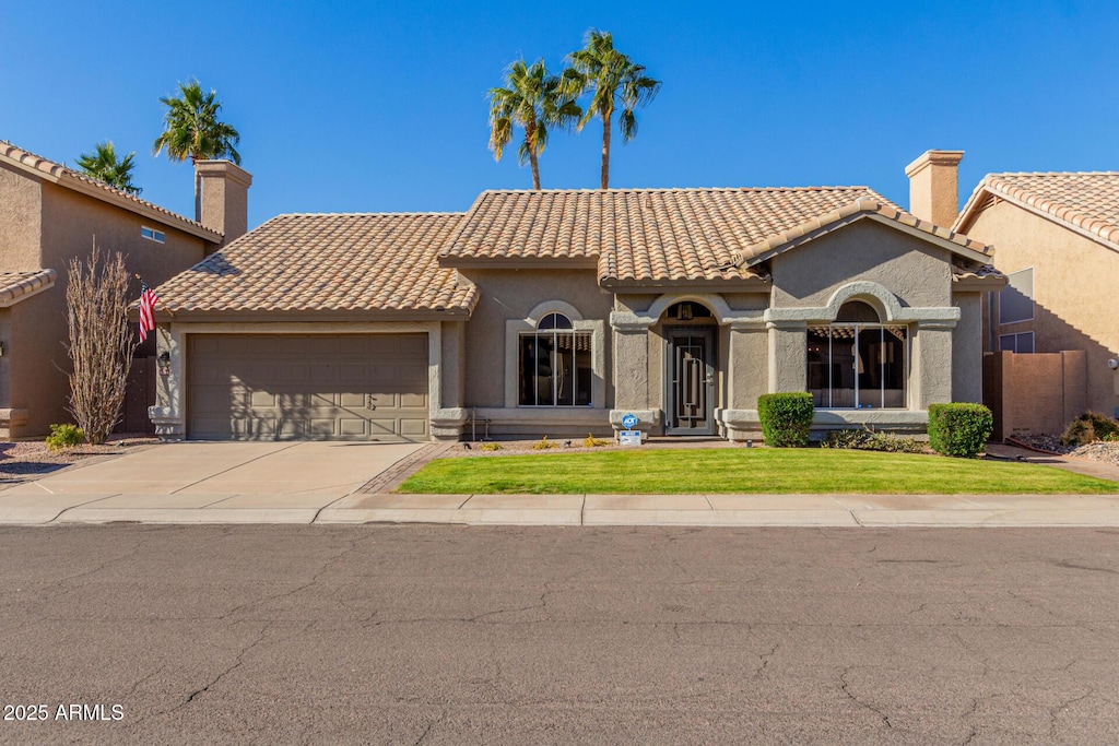 mediterranean / spanish-style home featuring a garage