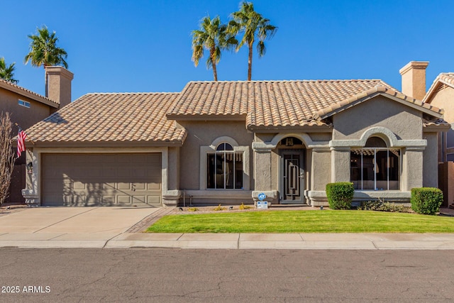 mediterranean / spanish-style house featuring a garage