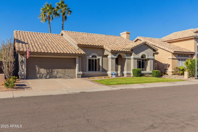 mediterranean / spanish-style house featuring a garage