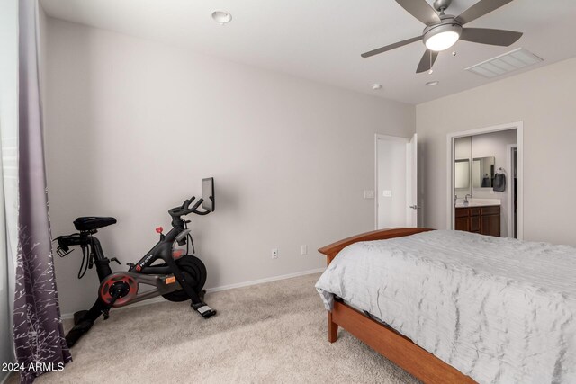 bedroom with baseboards, a ceiling fan, visible vents, and light colored carpet