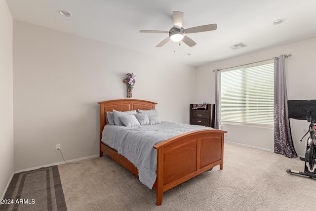 bedroom with light carpet, baseboards, visible vents, and ceiling fan